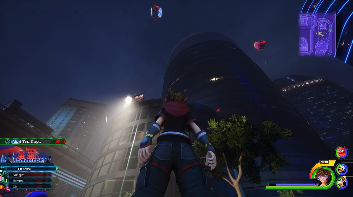 Sora gazing up at the circular building with fans spinning around it / Kingdom Hearts 3